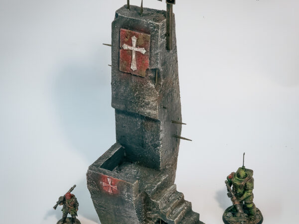 Detailed barbed wire and steel plate textures on grimdark concrete pedestal, hand-painted wargaming terrain.