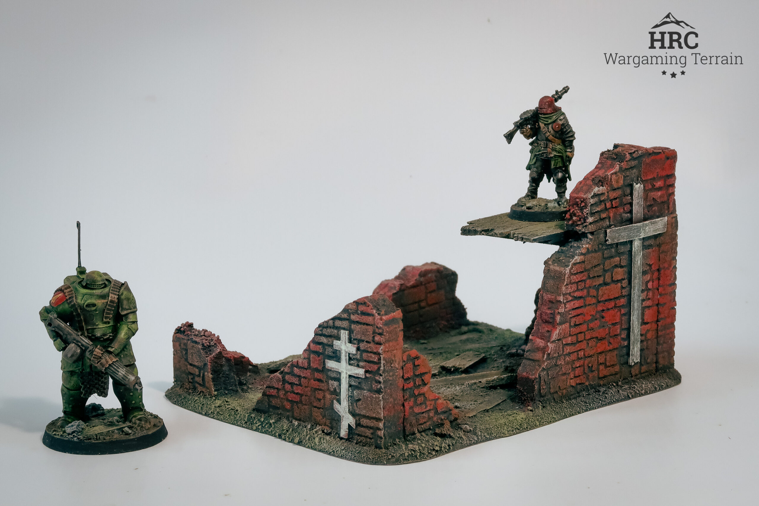 Inside of a ruined defensive position with painted crosses, grimdark terrain for skirmish wargames.