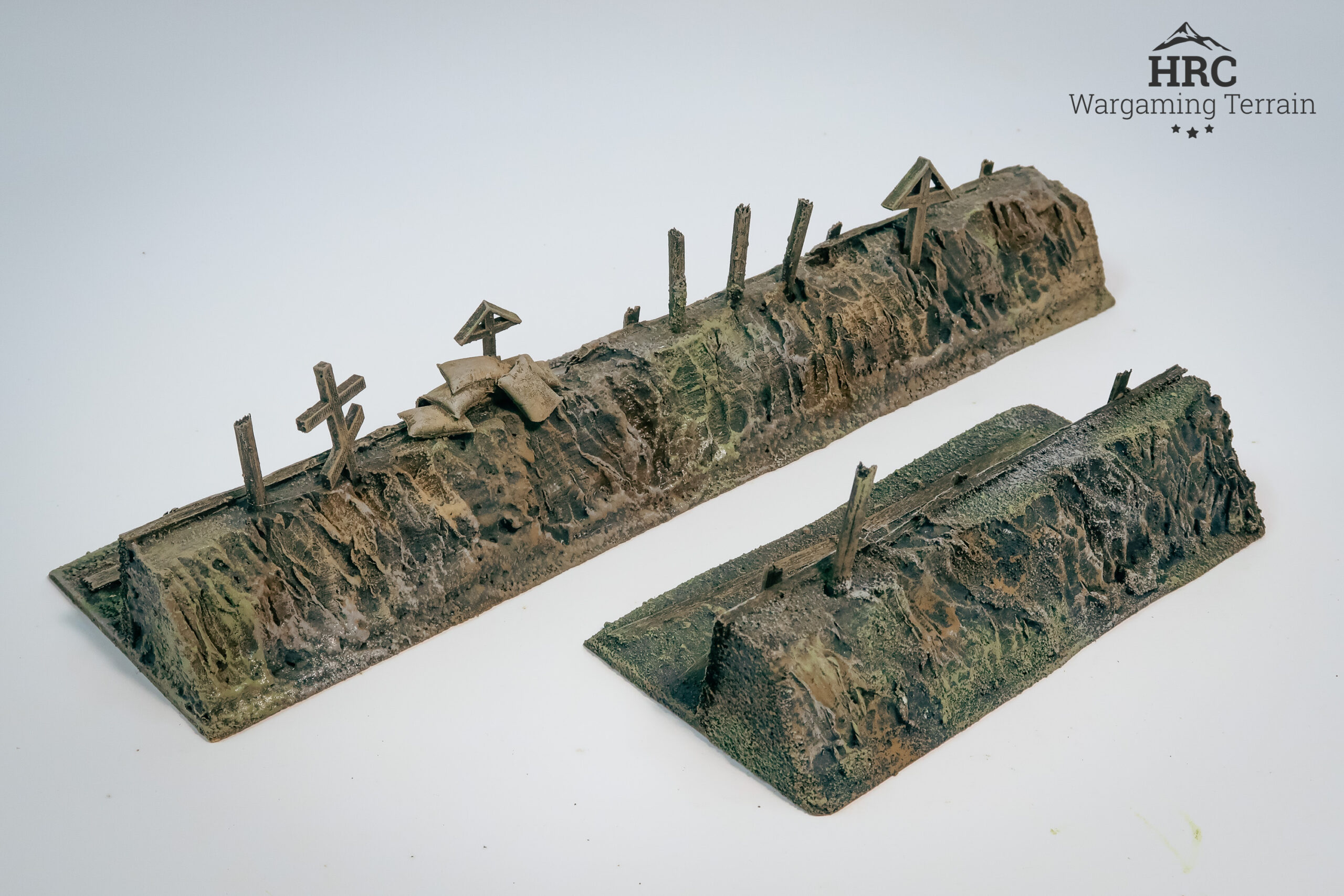 Detailed trench firing positions with scratched crosses and sandbags, ready-to-play wargaming scenery.